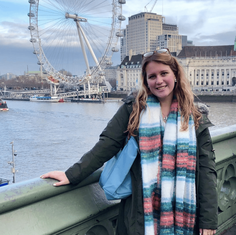 Sara Ramotnik standing in front of ferris wheel