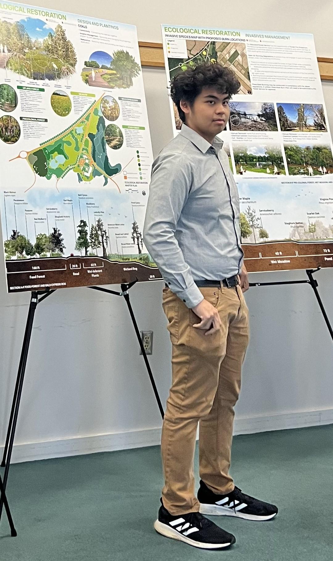 Student presenting scientific poster involving urban design.