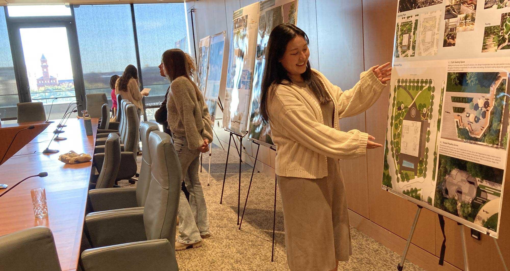 Charlotte Yang presents her design to museum curators and staff on site at the museum in Washington, D.C.