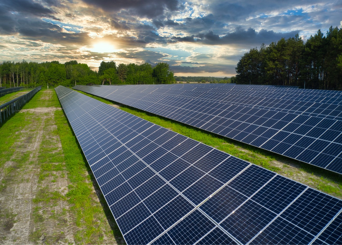 In a picturesque rural landscape, a series of solar panels are strategically positioned to capture and convert the abundant energy emitted by the sun.