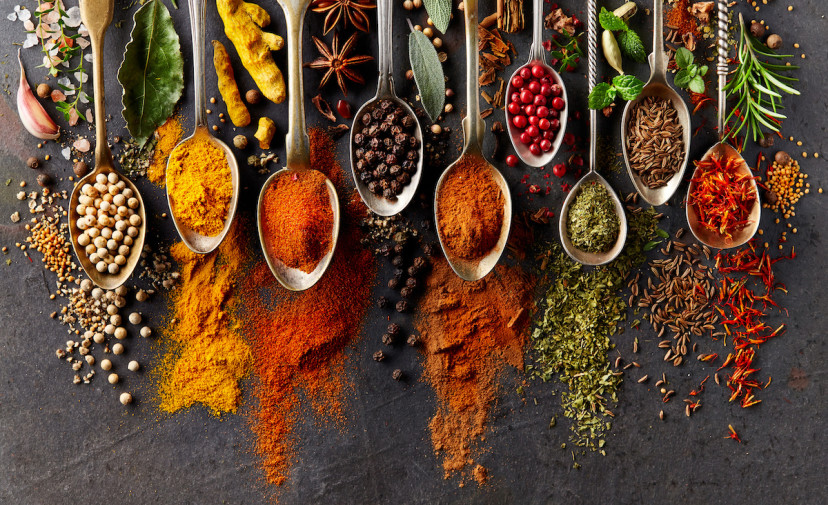 Spoonfuls of different herbs and spices
