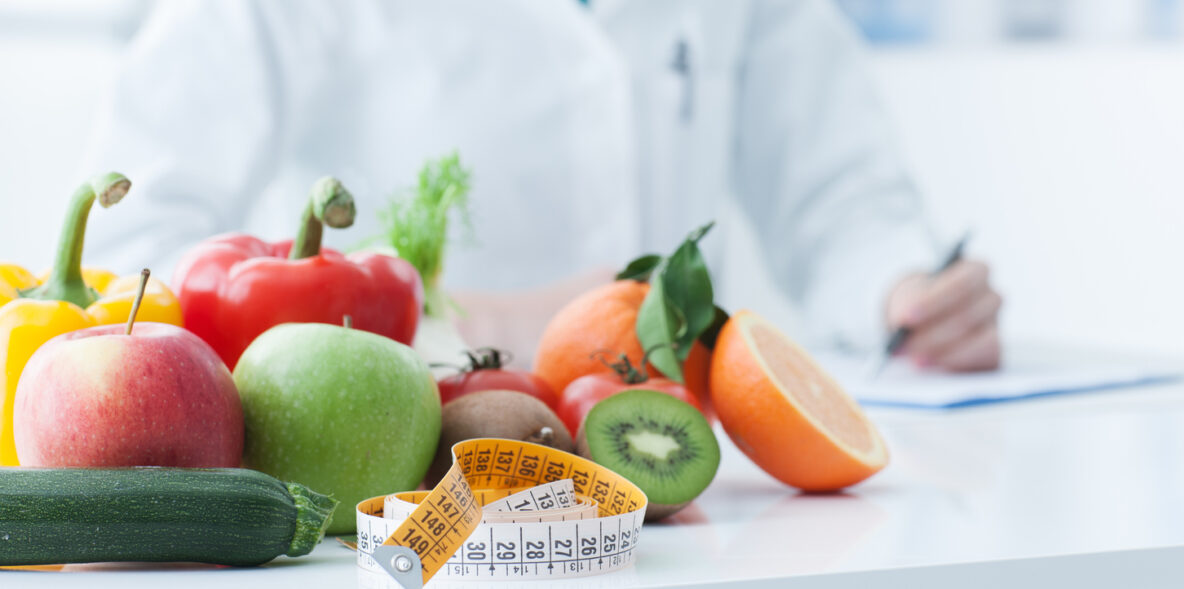 fresh produce with doctor in background