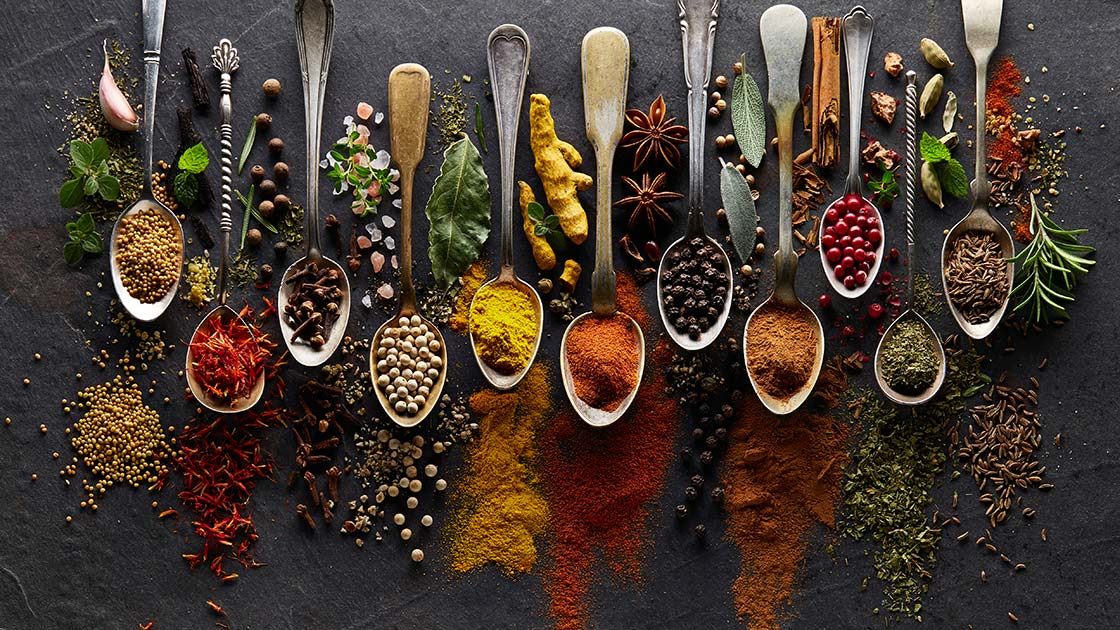 Herbs and spices in spoons