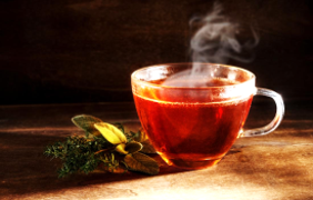 Hot steaming tea in a clear tea cup