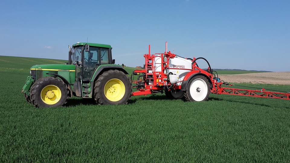 tractor with sprayer in a field
