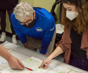 PG County's Trail Development Program Manager, Robert Patten, reviews plans with Landscape architecture student Mara Wolfe.