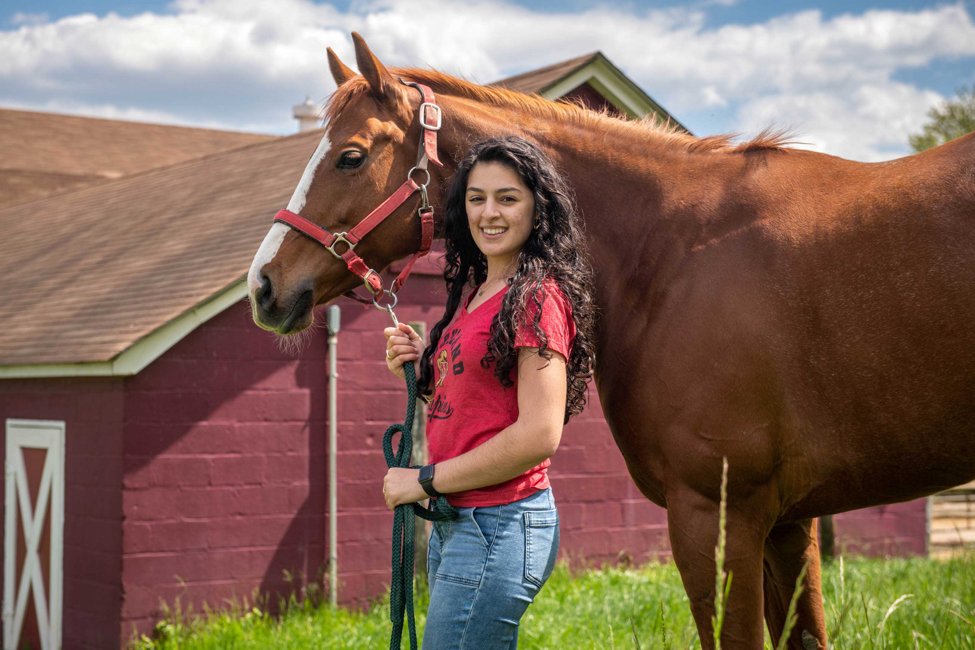 Student with a horse at the Campus Farm