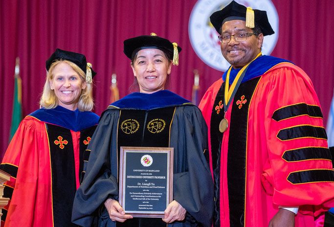 Liangli Yu stands with UMD President Darryll Pines and VP and Provost Jennifer King Rice