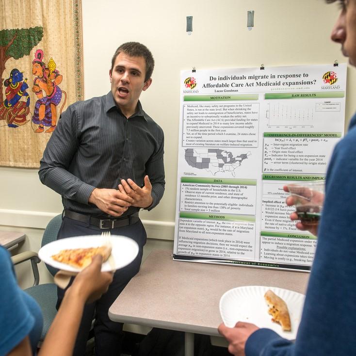 Student presenting at an event 
