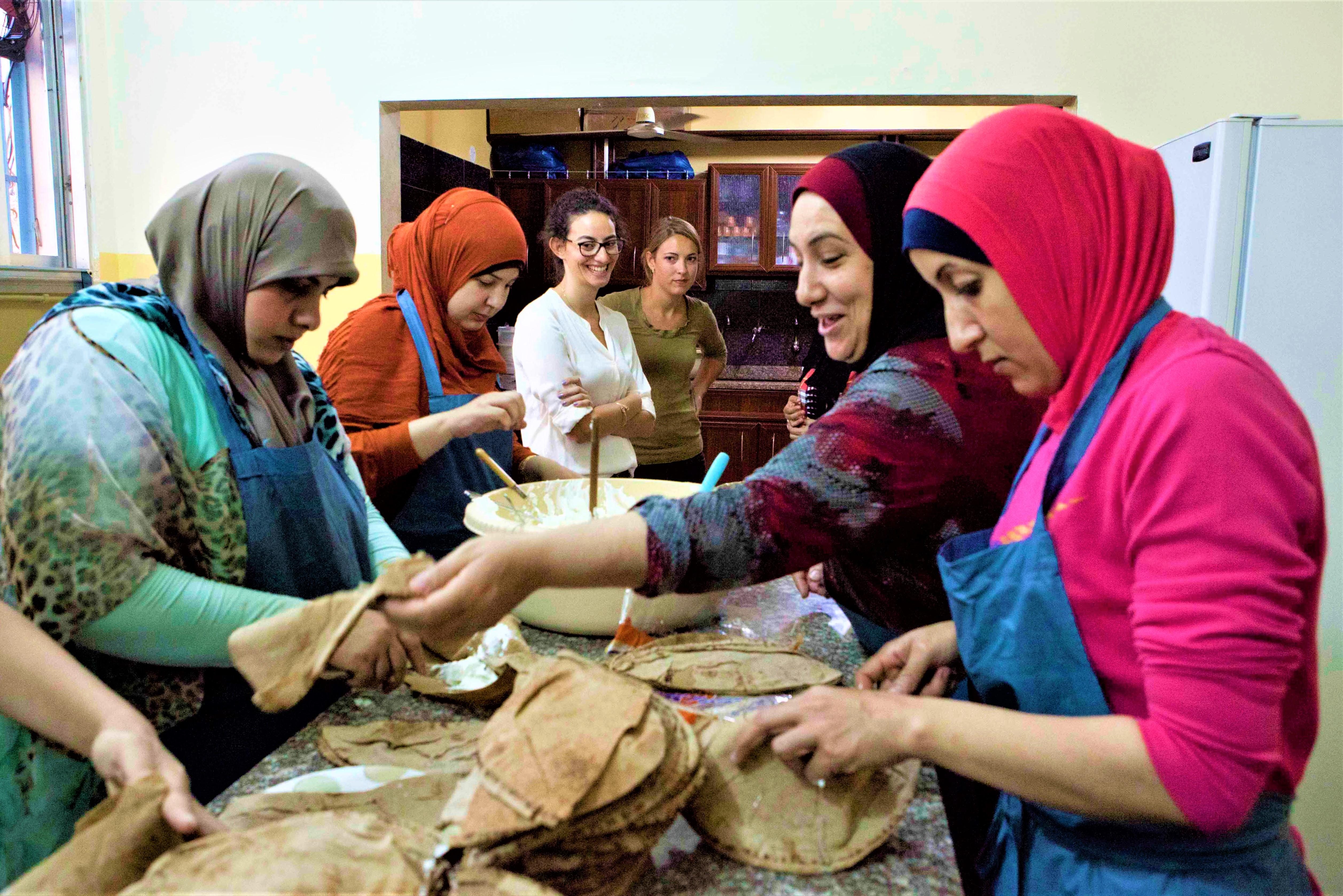 Palestinian women cooking for the Healthy Kitchens, Healthy Children intervention