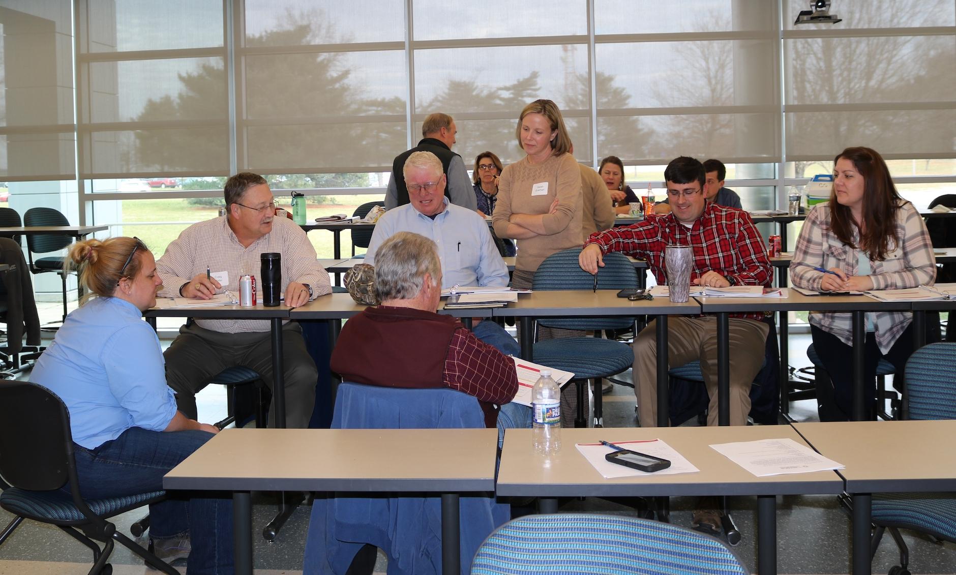 People talking at a Hughes Center event.