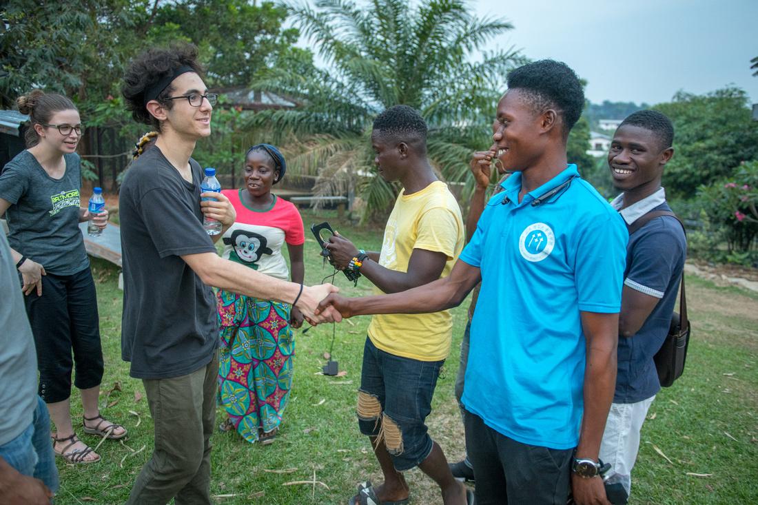 Students shaking hands in Africa