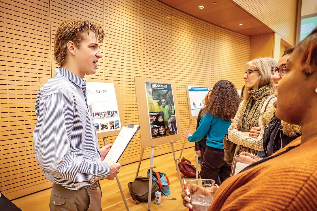 Brian Spinner talking with people at an event
