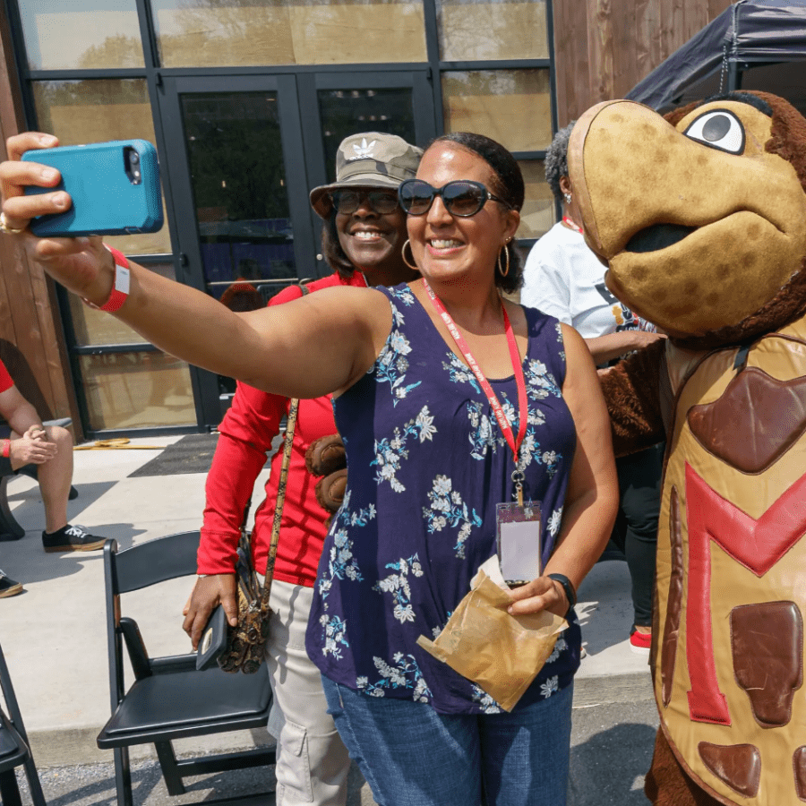 Black Alumni Weekend attendees taking a selfie with Testudo