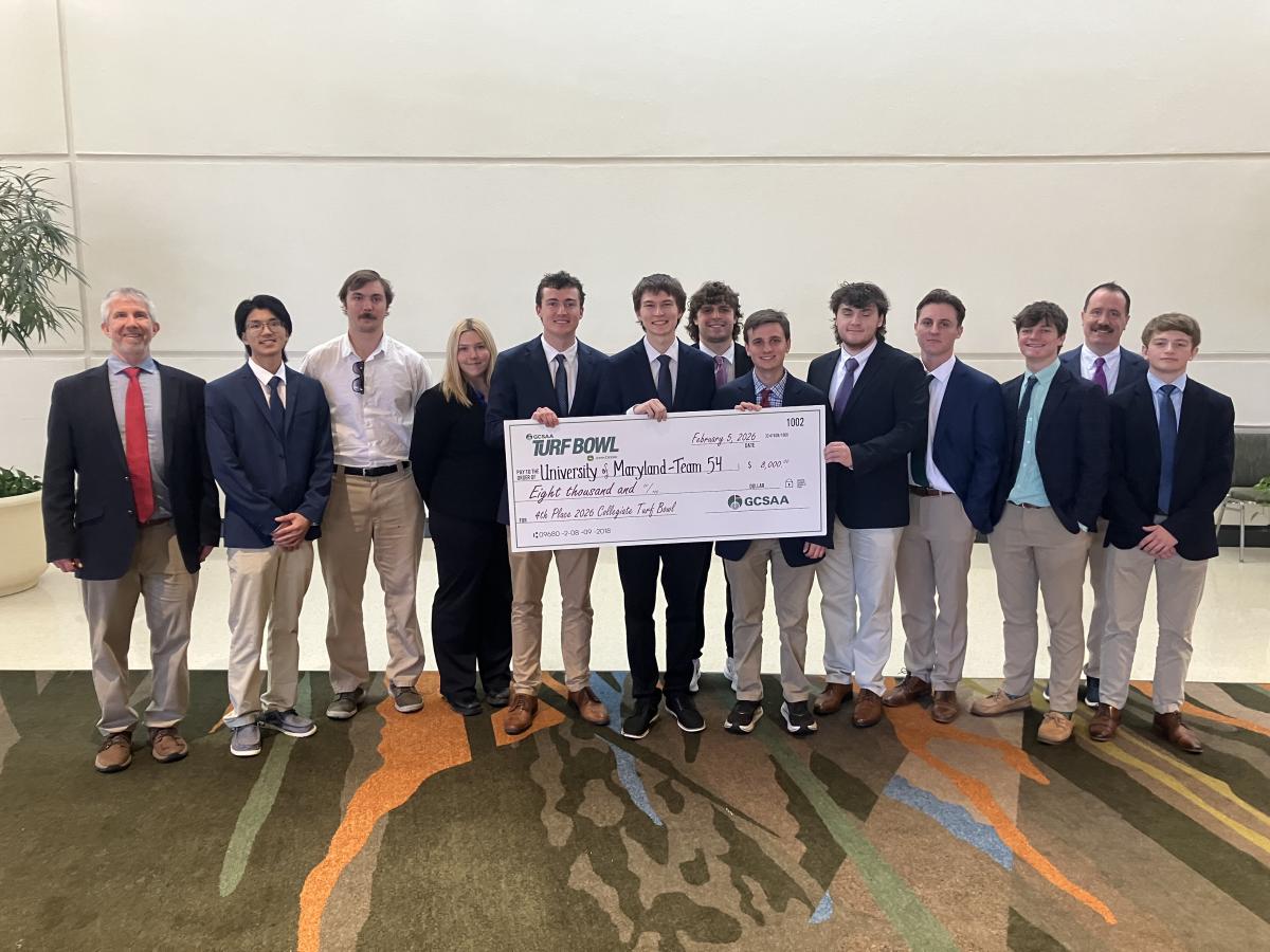 Students stand with award for placing at the National Turf Bowl Competition