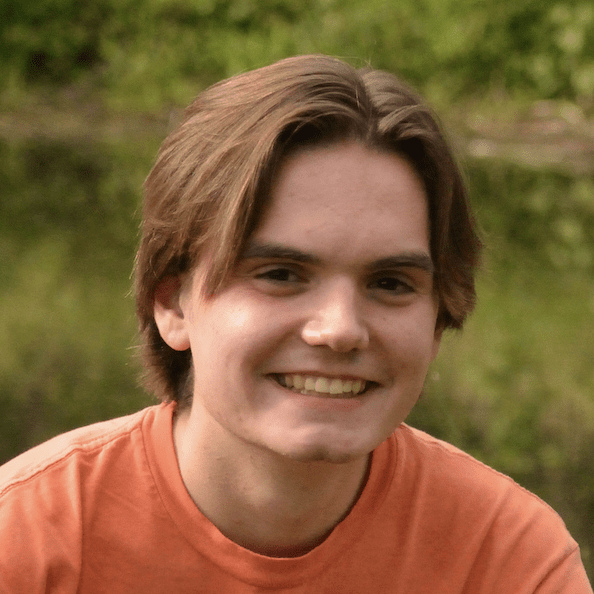 Teddy Jorgensen. Enthusiastic student with natural setting in background.